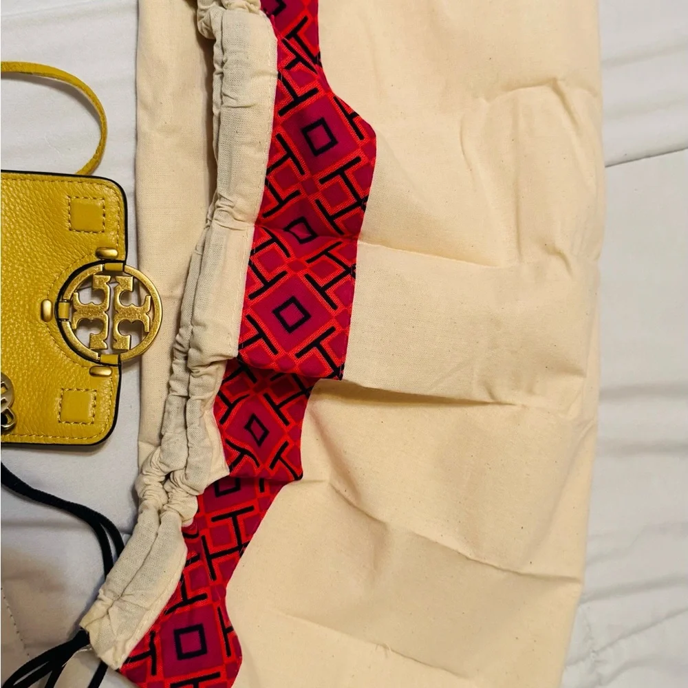 Tory Burch Mustard Yellow Fringe Crossbody bag.